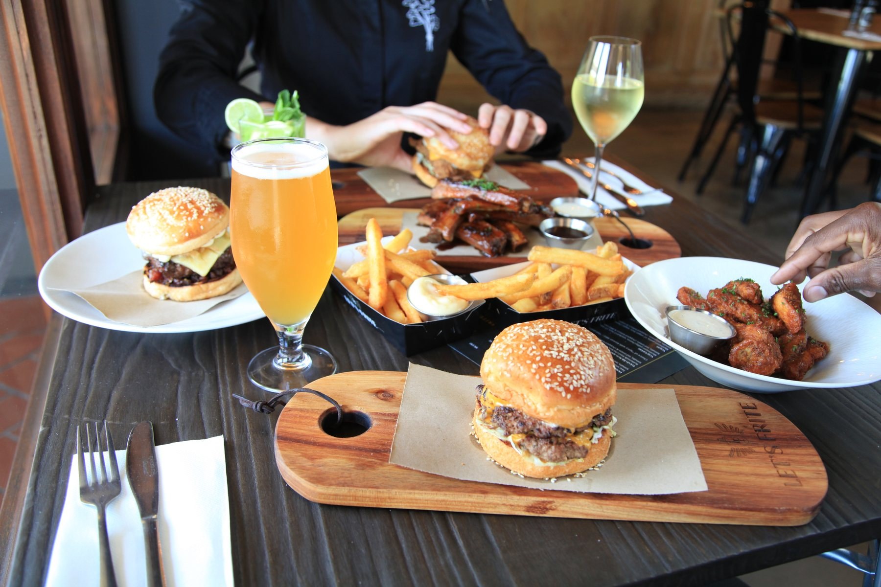 Burgers, ribs and frites at the table